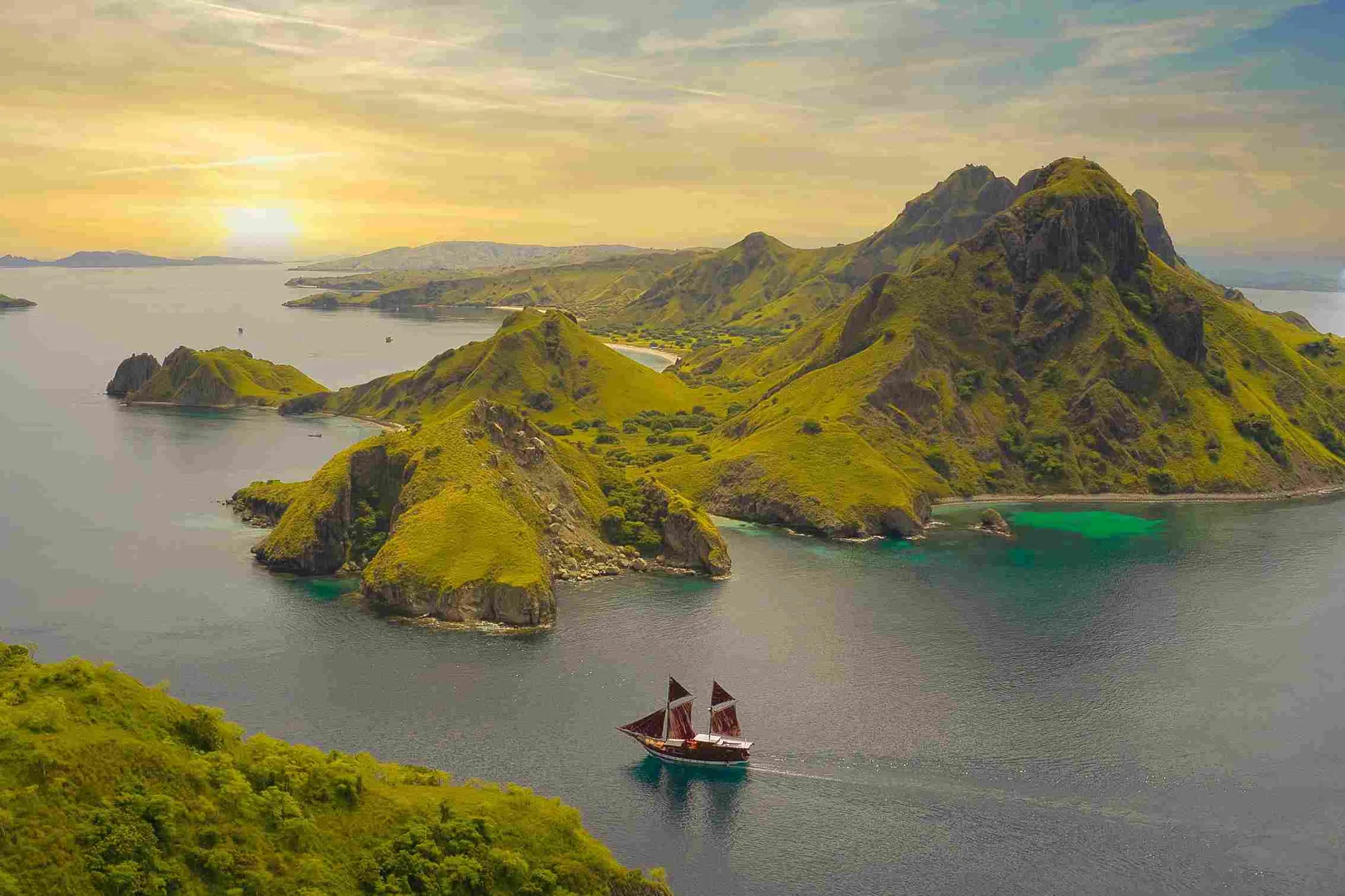 Sailing boat anchored in a calm bay in the Komodo archipelago