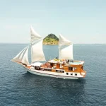 Lady Grace, a 34-metre traditional phinisi liveaboard, photographed at sea in Komodo National Park